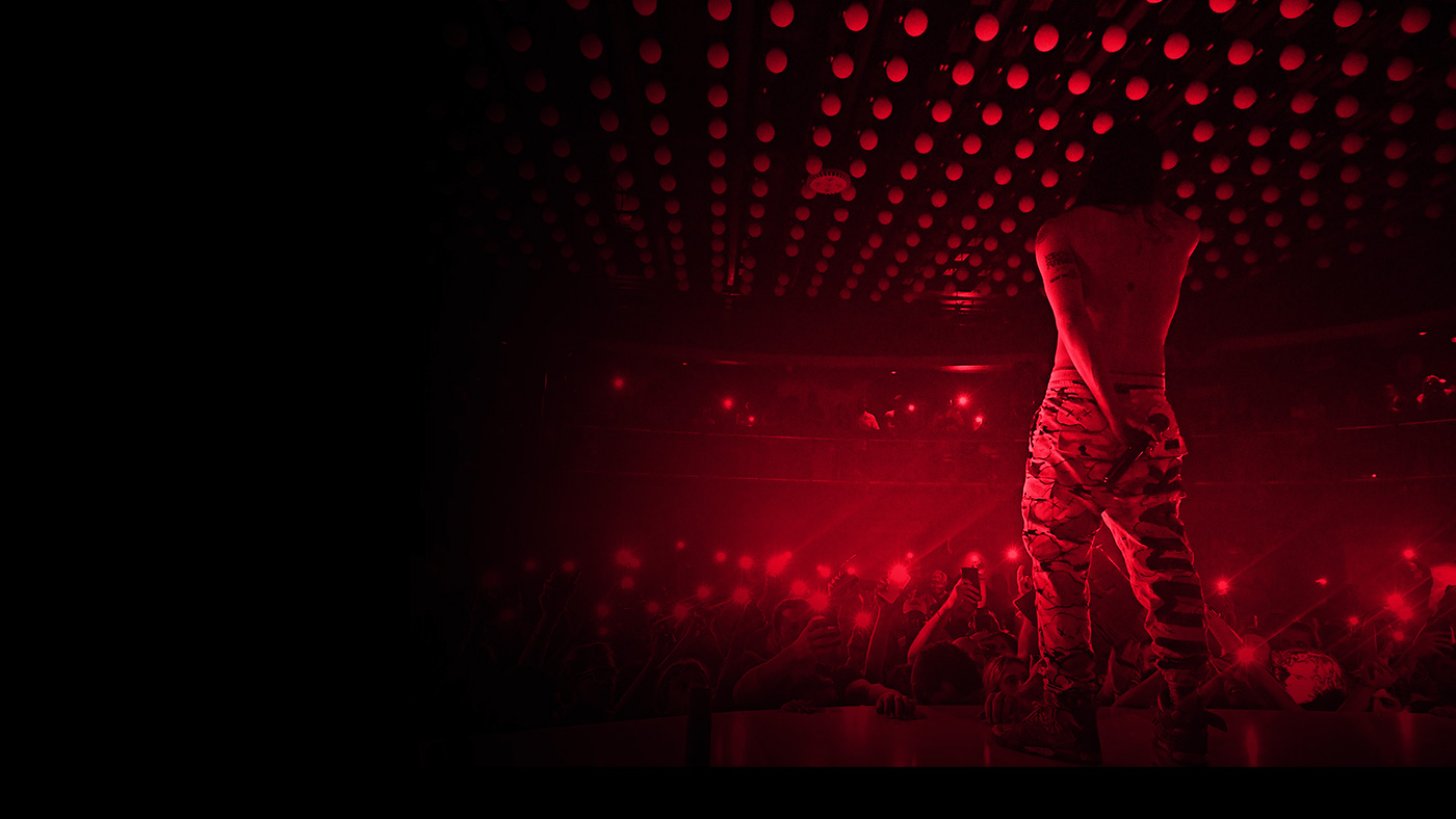 A packed night beneath District Atlanta's glowing kinetic orb ceiling